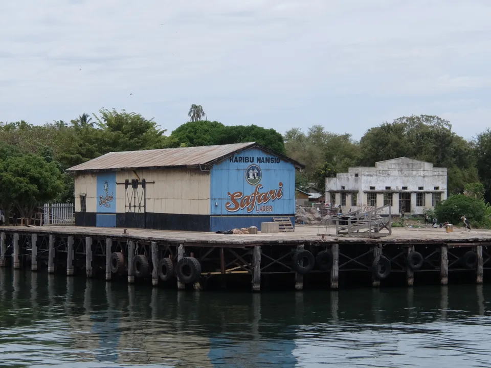 Buildings and a timber pier at Nansio on Ukerewe Island, seen from the water.